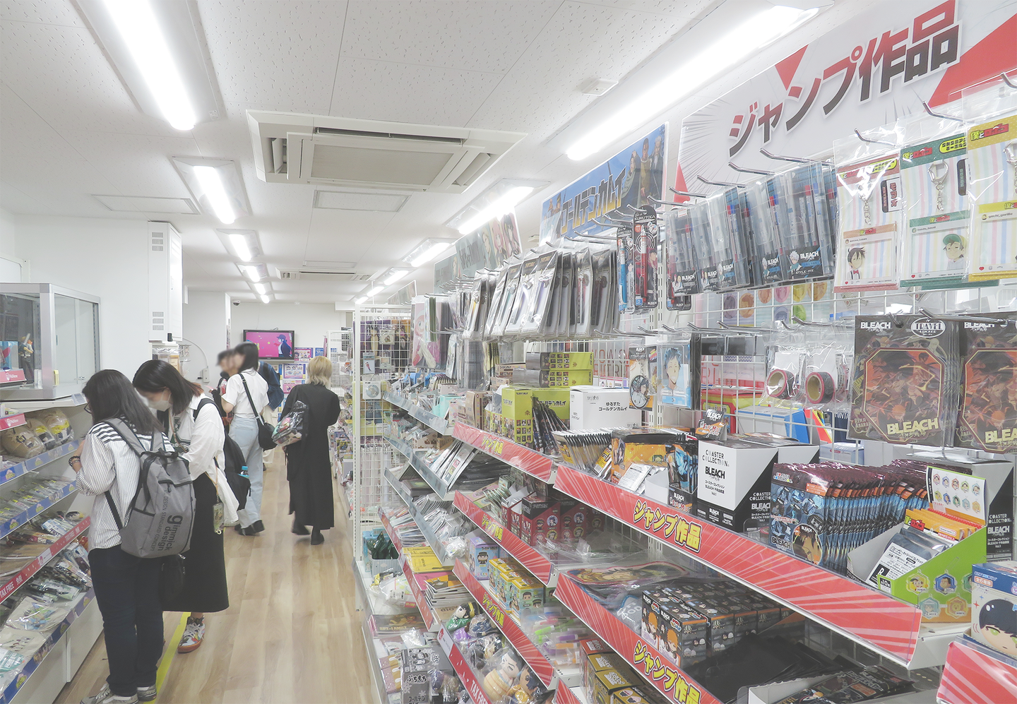 Interior view of Animate Akihabara store showcasing anime merchandise displays